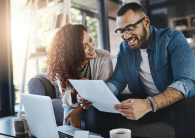 Shot of a young couple planning their budget together at home