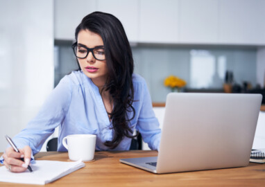 Woman,Working,With,Laptop,In,Home,Office