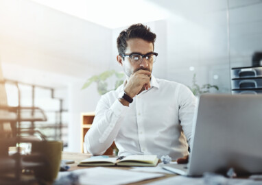 Shot of a young businessman working in an office